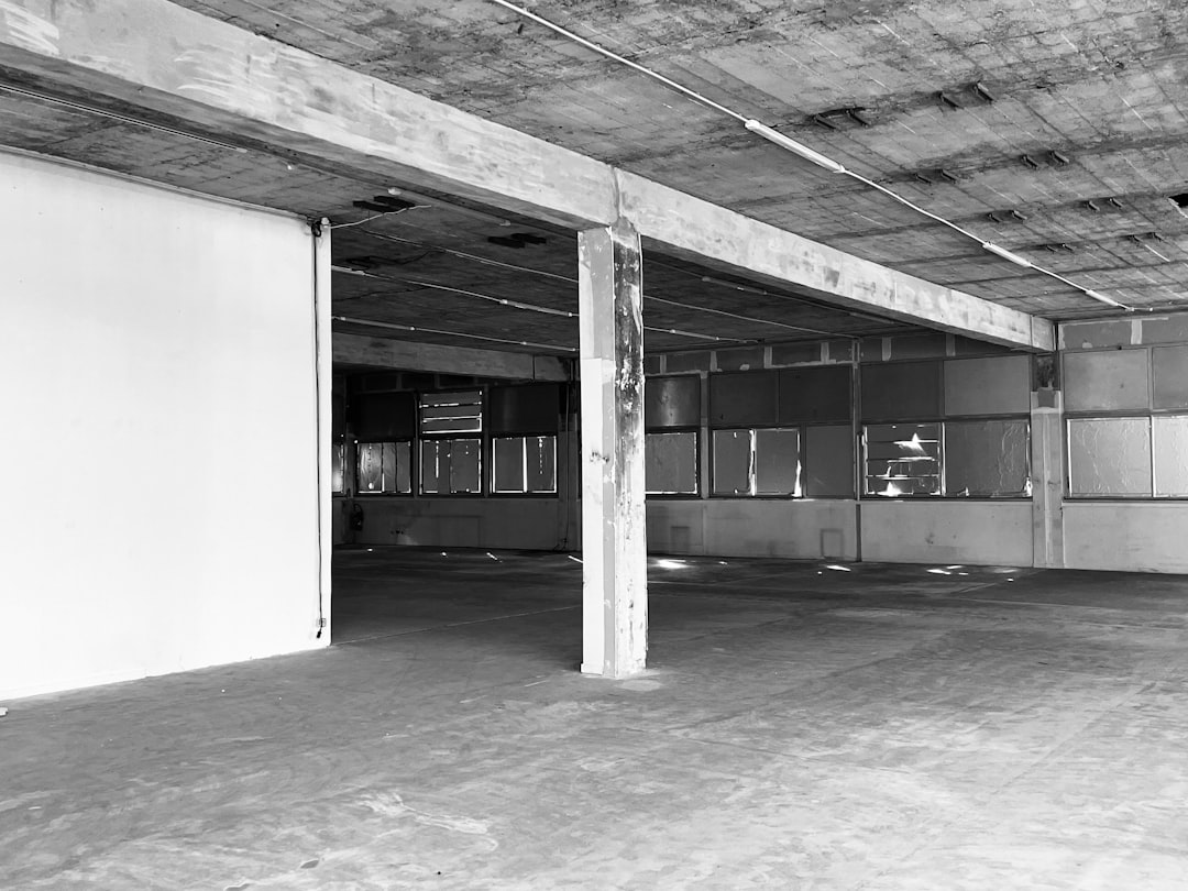 a-black-and-white-photo-of-an-empty-parking-garage-5ewwbd-5c4